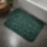 Elegant dark green memory foam bath mat on a sleek bathroom floor